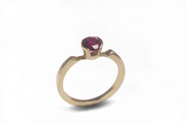 Alma Ring - 14k yellow gold ring with a 5mm round facet cut Rubi stone